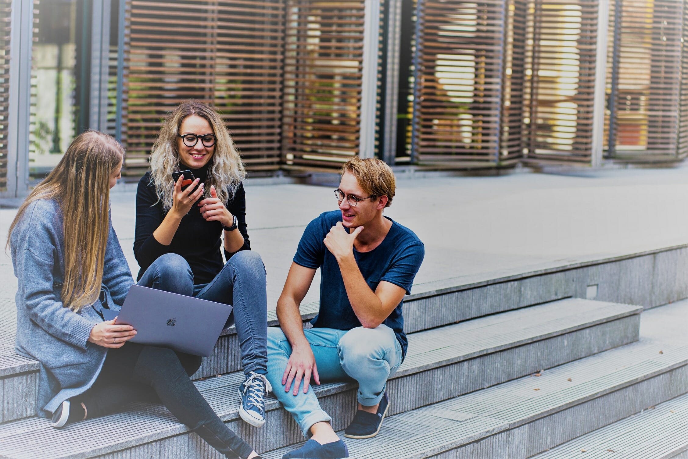 https://www.pexels.com/photo/three-persons-sitting-on-the-stairs-talking-with-each-other-1438072/